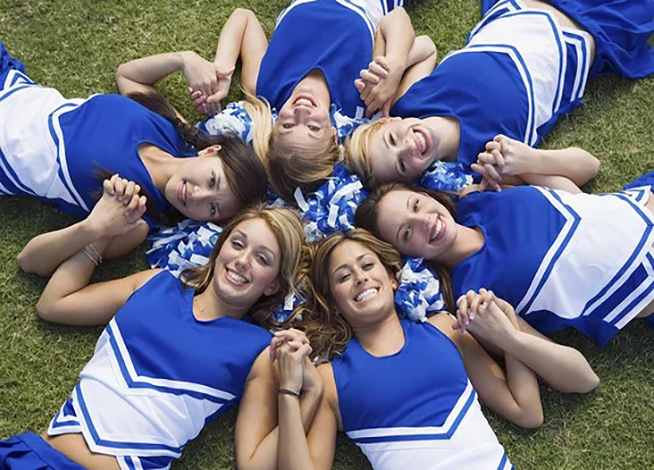 Group of cheer team members benefiting from a successful cookbook team fundraiser